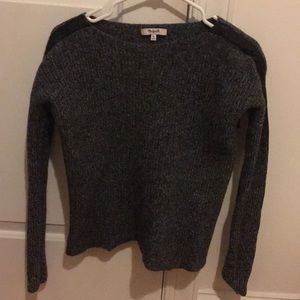 Grey sweater with black leather strip on sleeve
